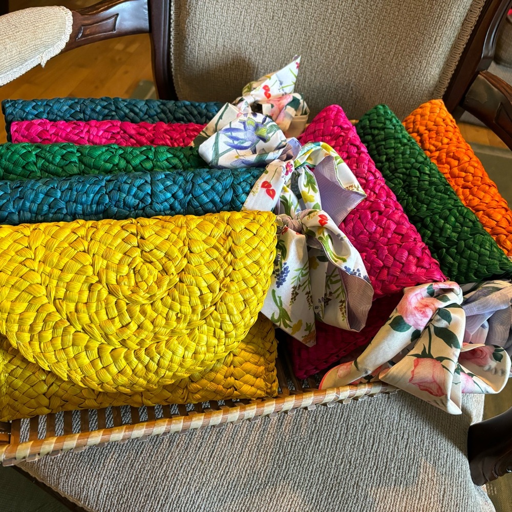 Colorful,straw clutches w/an added bonus of a colorful scarf tied on the side!